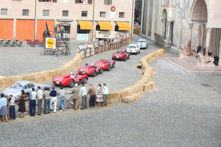 a group of people standing in front of a building