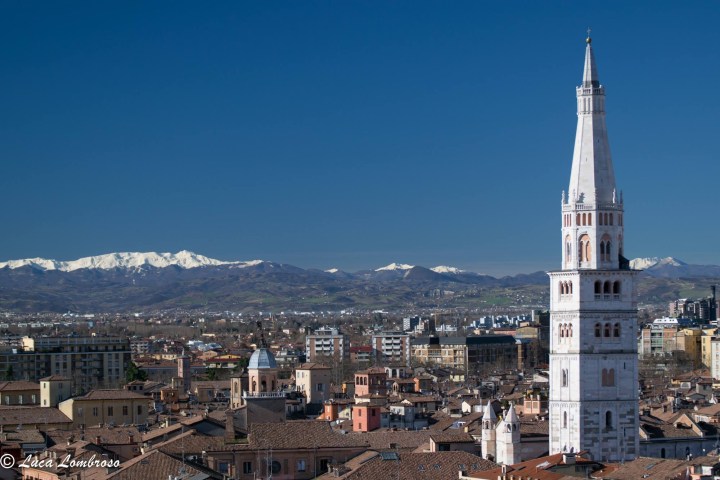 a large clock tower towering over a city