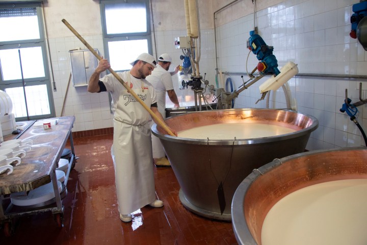 a person cooking food in a bowl