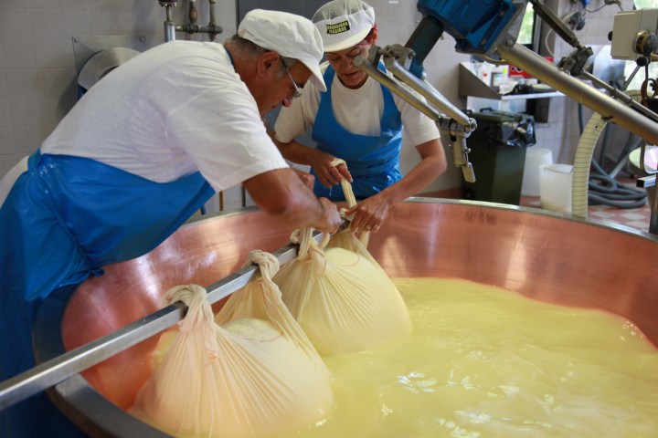a man preparing food in a bowl